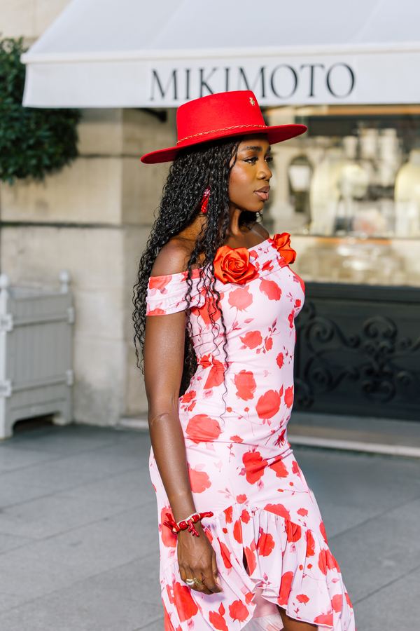 Street style: red floral off-shoulder dress, red hat, Place Vendôme, Paris