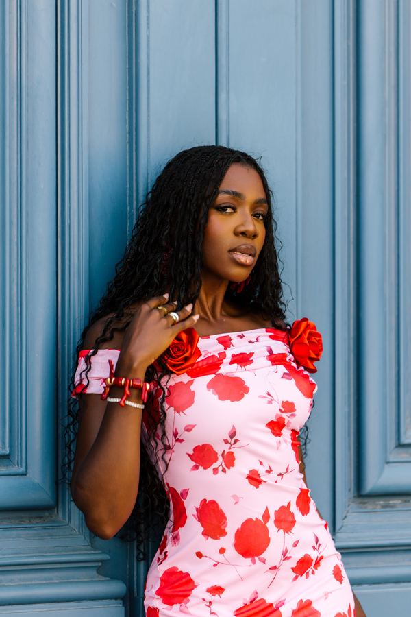 Portrait of a woman in red floral off-shoulder dress, Place Vendôme, Paris