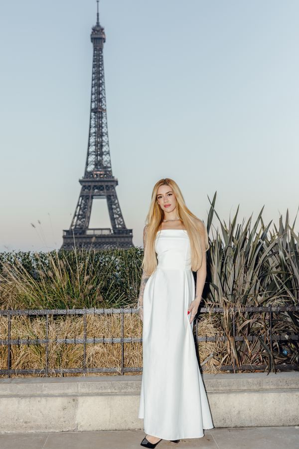 Portrait of a woman in white strapless gown, Eiffel Tower, Paris