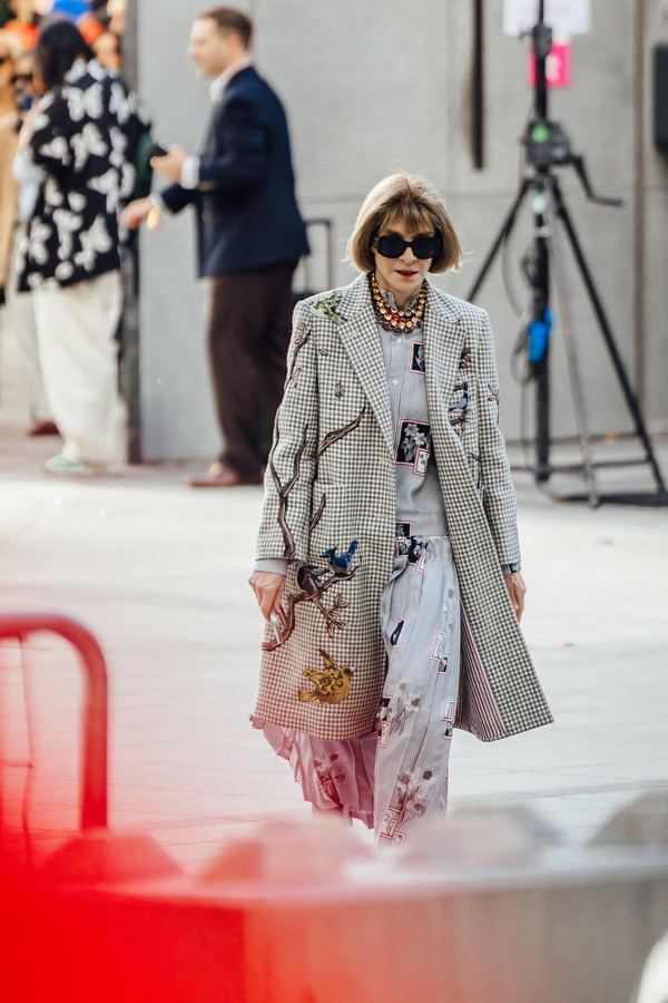 Street style at Paris Fashion Week: houndstooth coat, floral dress, sunglasses, Paris