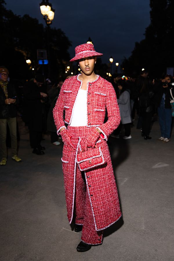 Street style at Paris Fashion Week: red tweed suit, bucket hat, Paris at dusk
