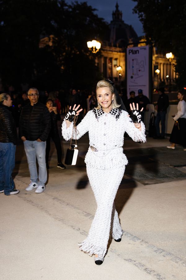 Street style at Paris Fashion Week: white tweed suit, black collar, black gloves, Paris at night