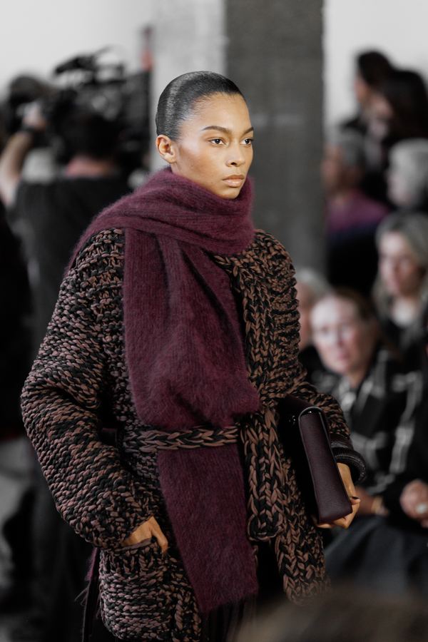 Street style at Paris Fashion Week: leopard print long coat, burgundy scarf, dark belt, Paris