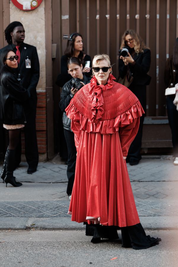 Street style: red ruffled cape gown, black sunglasses, Paris