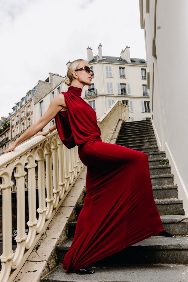 Portrait of a woman in red draped gown, sunglasses, Paris