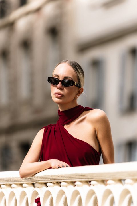Close portrait with sunglasses and a red dress